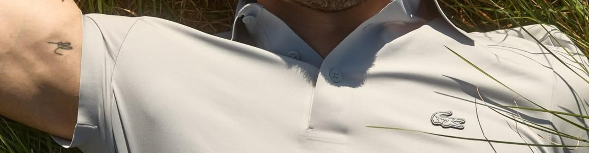 Lacoste desktop banner highlighting premium casualwear and lifestyle fashion collection