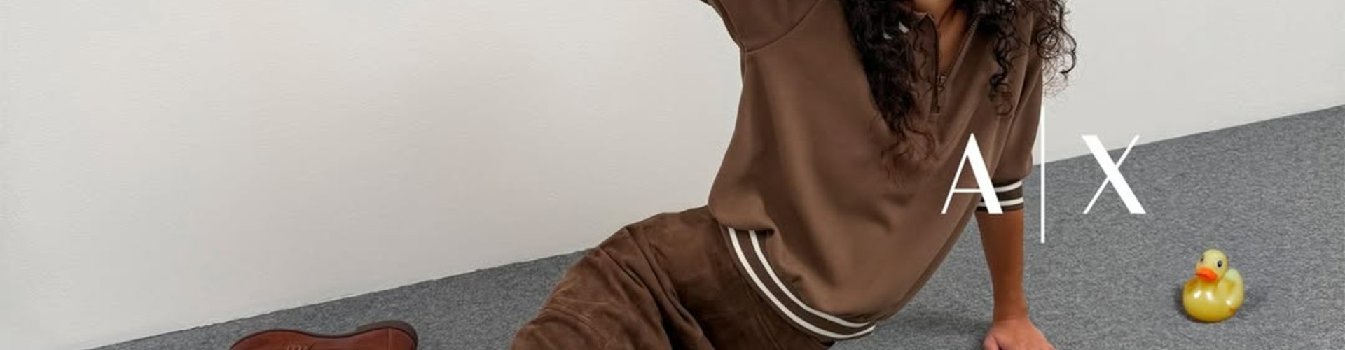 Armani Exchange desktop banner highlighting premium fashion and contemporary style collection