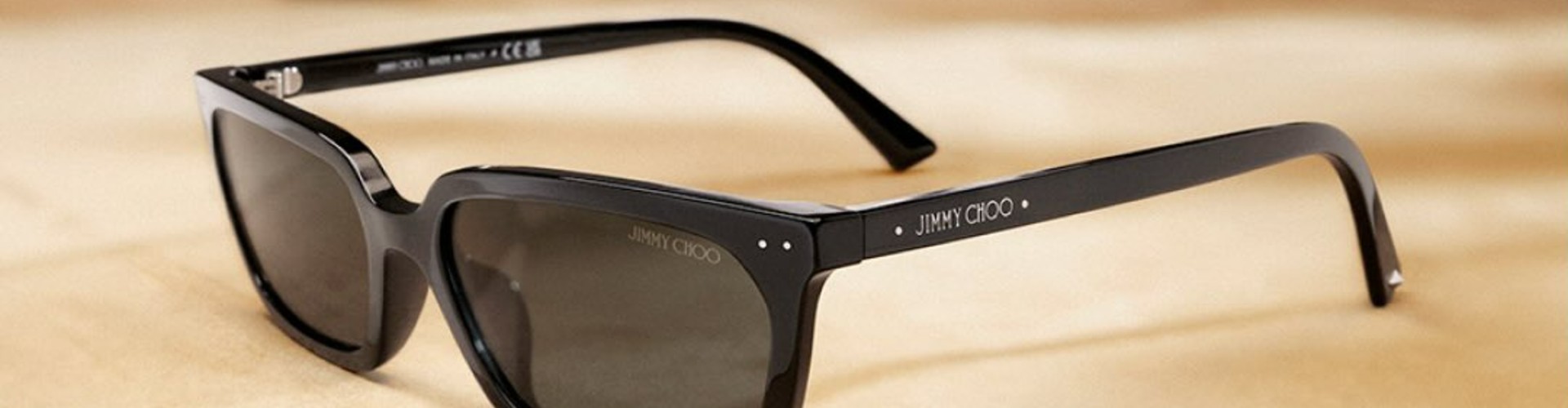 Sunglass Hut desktop banner highlighting premium sunglasses and designer eyewear collection