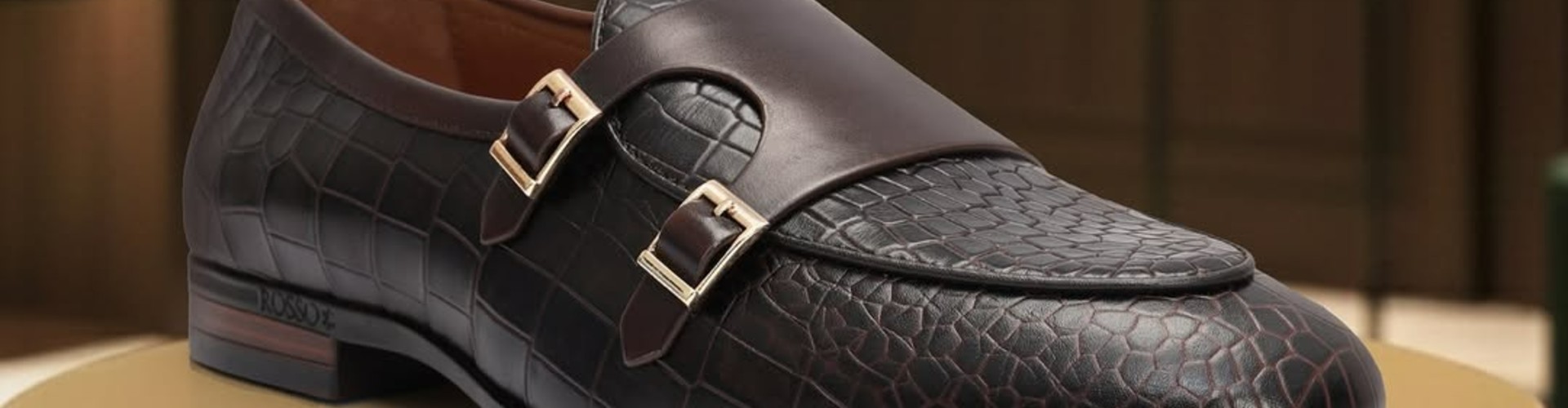 Rosso Brunello desktop banner highlighting premium footwear and leather accessories collection