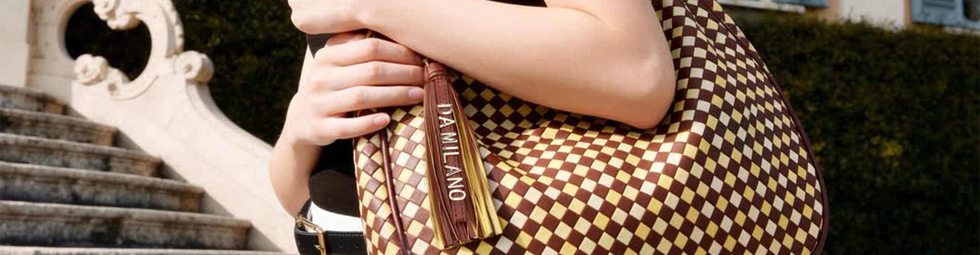 Da Milano desktop banner highlighting luxury leather accessories and premium fashion collection
